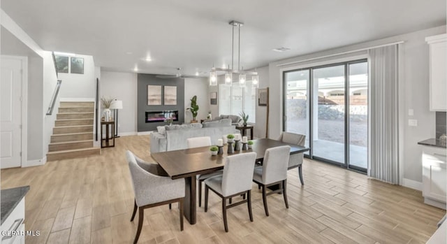 dining space with light wood-type flooring