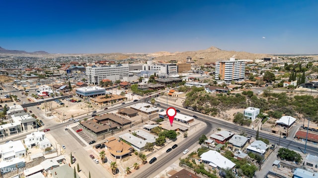 birds eye view of property featuring a mountain view