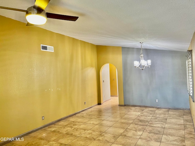 unfurnished room featuring ceiling fan with notable chandelier and a textured ceiling