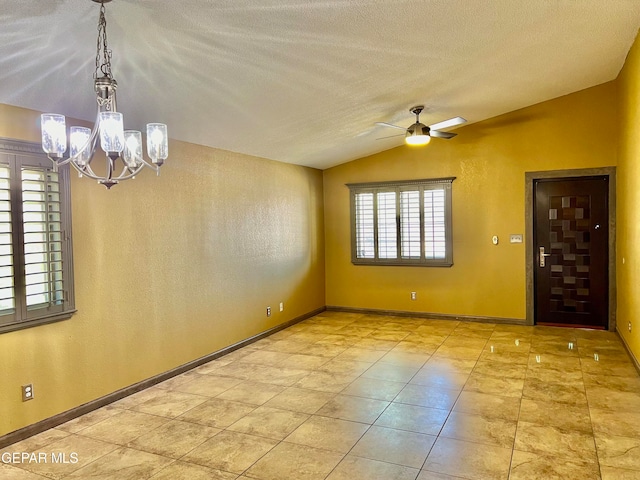 unfurnished room featuring a textured ceiling, ceiling fan with notable chandelier, and vaulted ceiling