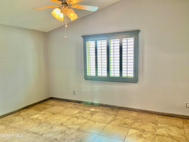 unfurnished room with a textured ceiling, lofted ceiling, and ceiling fan