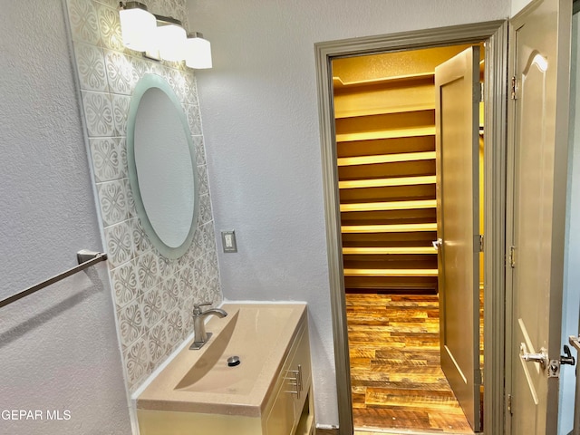 bathroom with wood-type flooring and vanity