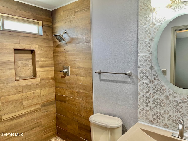 bathroom with a shower and toilet