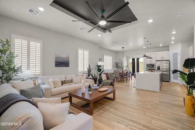 12741 Eltham Dr, Horizon City, TX 79928 - living area with recessed lighting, ceiling fan, visible vents, and light wood-style floors