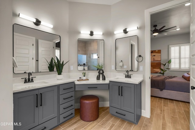 12741 Eltham Dr, Horizon City, TX 79928 - ensuite bathroom featuring vanity, ceiling fan, and wood tiled floor