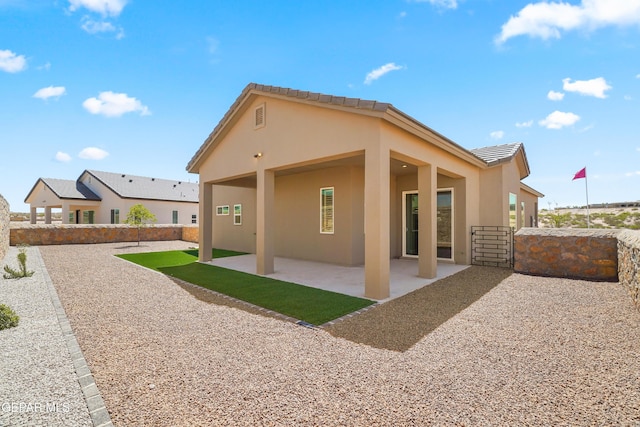 12741 Eltham Dr, Horizon City, TX 79928 - back of property featuring a patio area and stucco siding