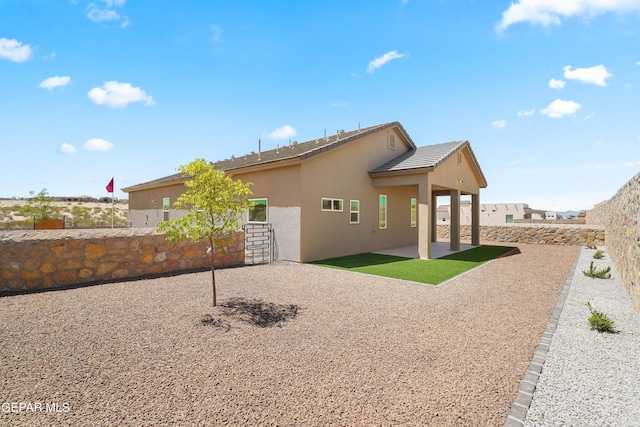 12741 Eltham Dr, Horizon City, TX 79928 - back of property with a patio, stucco siding, and fence