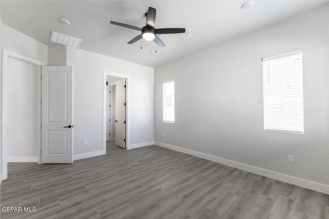 unfurnished bedroom featuring hardwood / wood-style flooring and ceiling fan