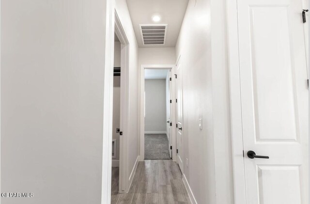 corridor featuring light wood-type flooring