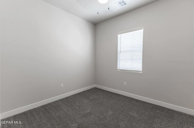 spare room featuring carpet floors and ceiling fan