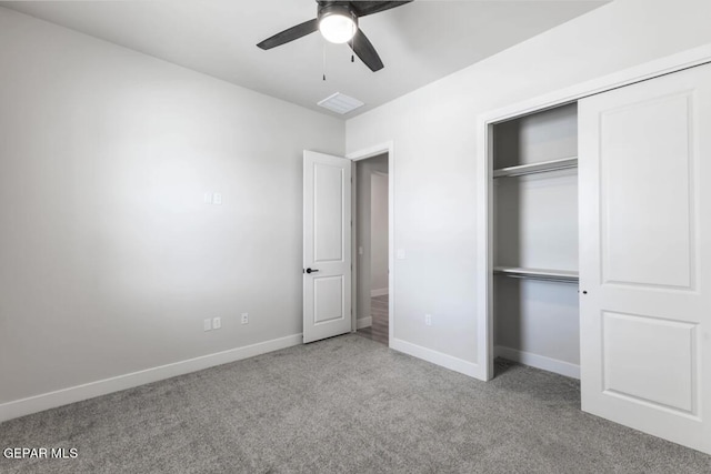 unfurnished bedroom with a closet, ceiling fan, and light colored carpet