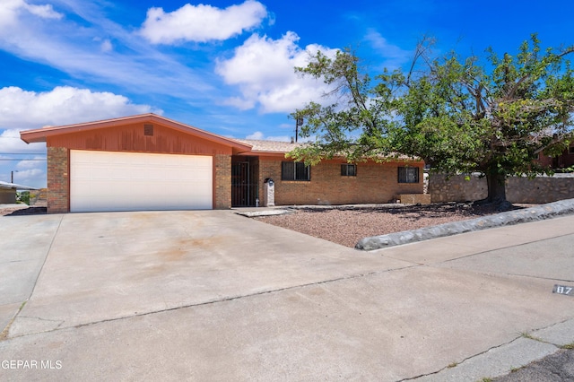 single story home with a garage