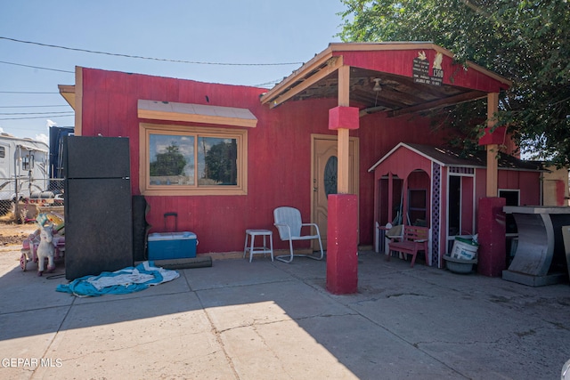 view of shed featuring fence