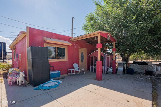 rear view of house with a patio area