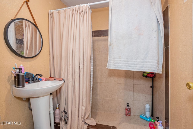 bathroom with a textured wall