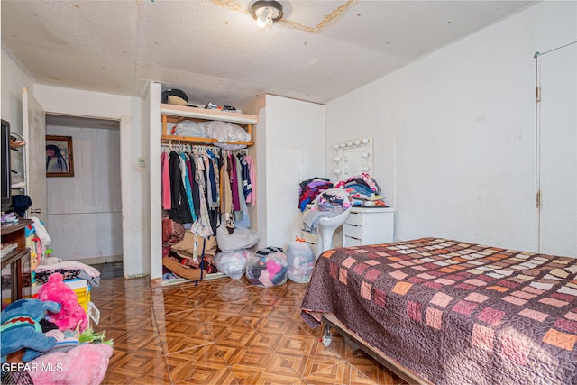 bedroom featuring a closet and a textured ceiling