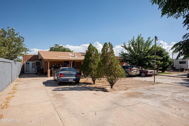 view of front of property featuring fence