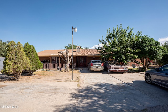 view of front of property with driveway and a porch