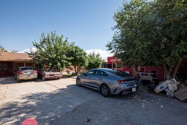 view of parking / parking lot featuring driveway