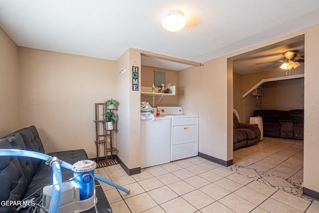 washroom with light tile patterned floors, ceiling fan, laundry area, independent washer and dryer, and baseboards