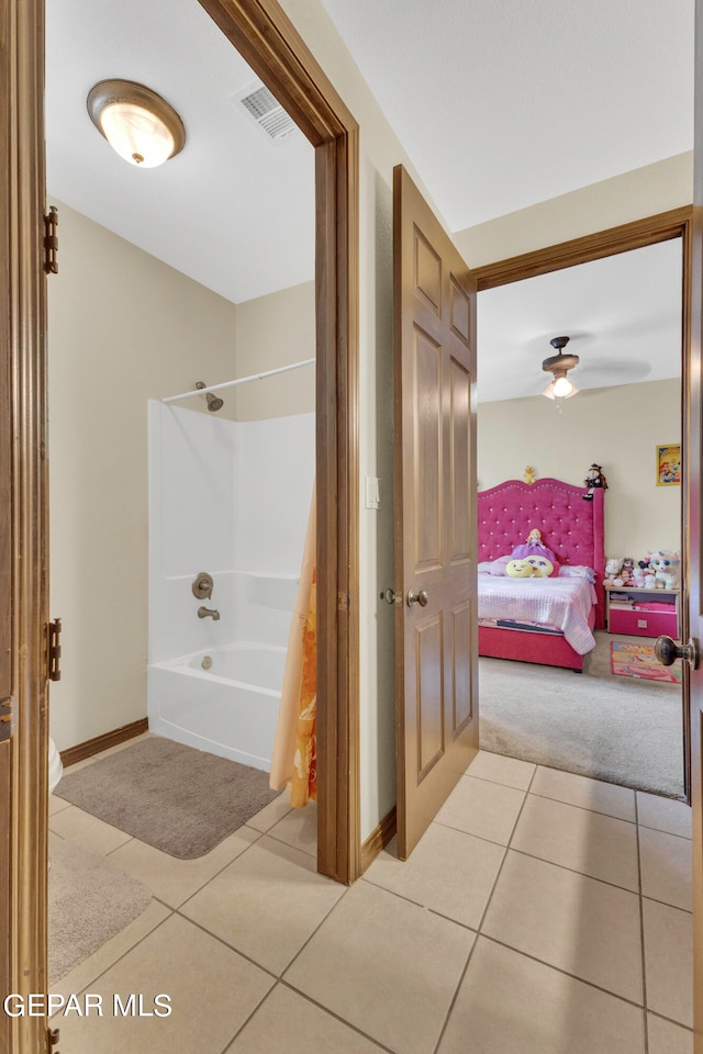 bathroom featuring tile patterned floors and bathtub / shower combination