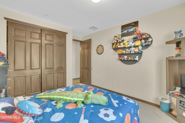 carpeted bedroom with a closet