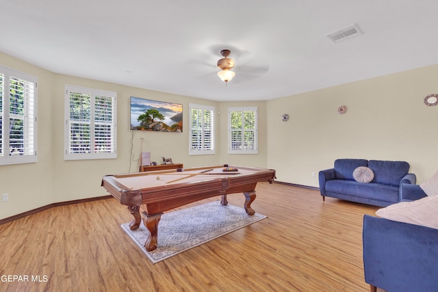 rec room with light wood-type flooring, a wealth of natural light, and billiards