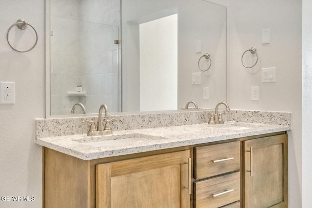 full bathroom featuring double vanity and a sink