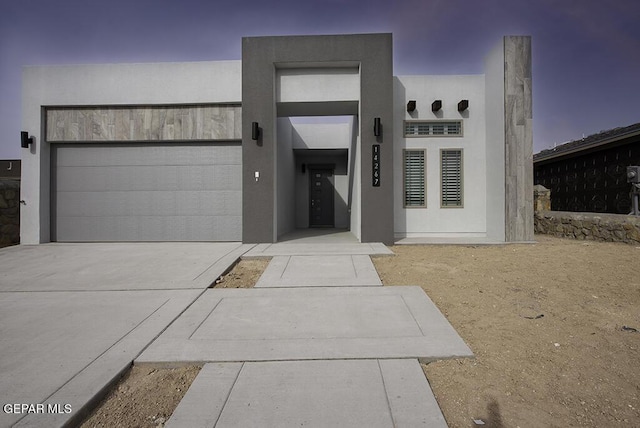 view of exterior entry with a garage