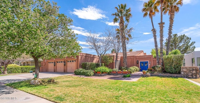 view of front of house with a garage and a front yard