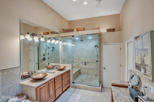 bathroom with vanity and a shower with shower door