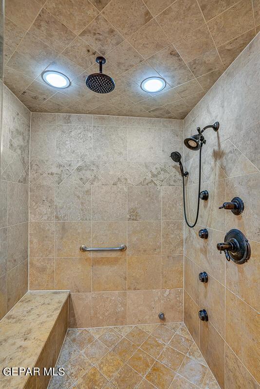 bathroom featuring tiled shower