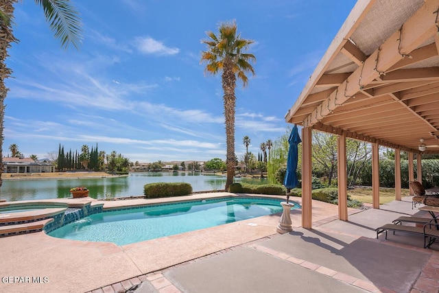 view of pool with a patio, a water view, and an in ground hot tub