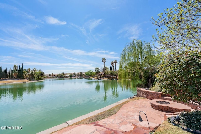 view of water feature with an outdoor fire pit