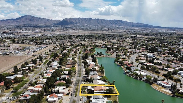 bird's eye view with a water and mountain view