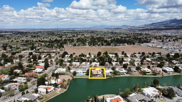 drone / aerial view with a water and mountain view