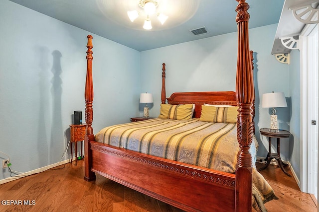 bedroom featuring hardwood / wood-style flooring