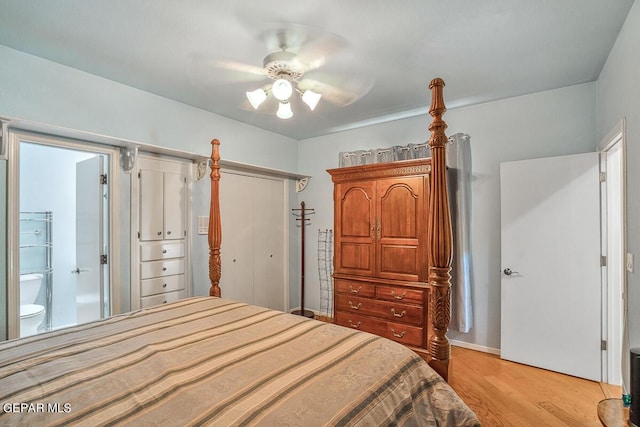 bedroom featuring ensuite bathroom, light wood-type flooring, ceiling fan, and a closet