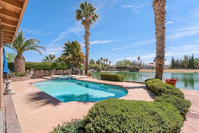 view of pool with a water view, an in ground hot tub, and a patio