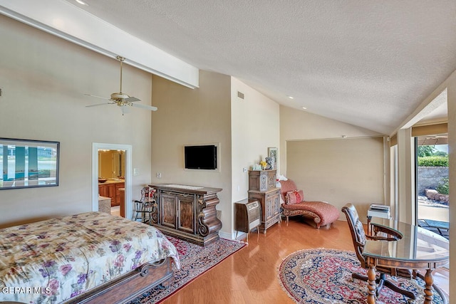 bedroom with vaulted ceiling, access to exterior, ceiling fan, light hardwood / wood-style floors, and a textured ceiling