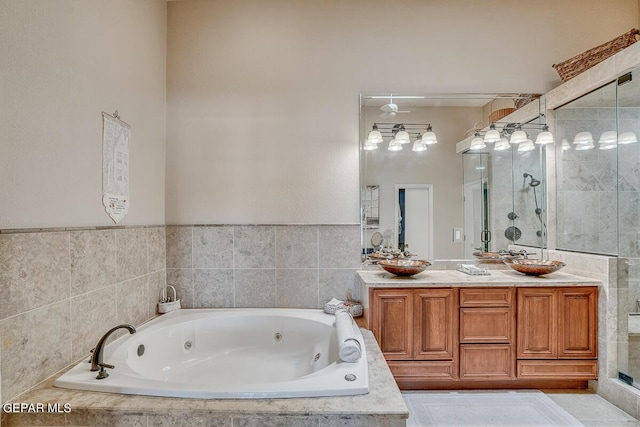 bathroom with independent shower and bath and vanity