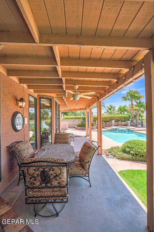 view of patio featuring ceiling fan