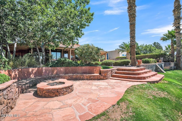 view of patio featuring a fire pit