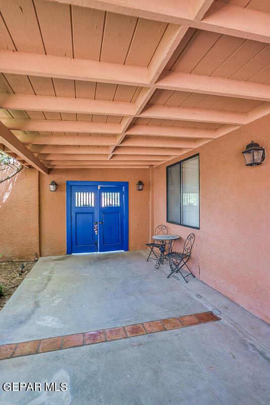 entrance to property featuring a patio area