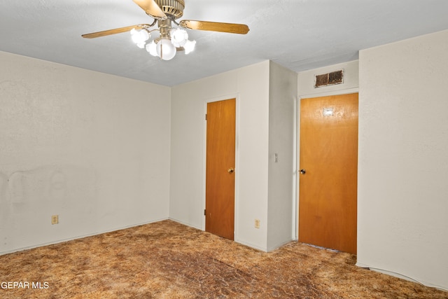 empty room with carpet and ceiling fan