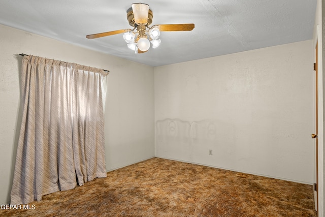 carpeted empty room featuring ceiling fan