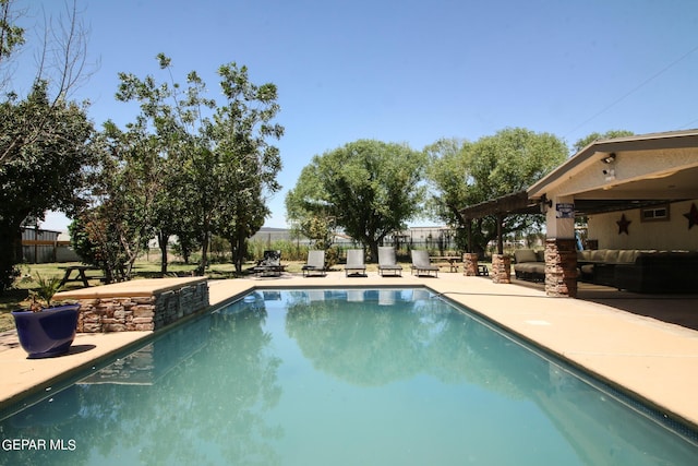 view of swimming pool featuring a patio area