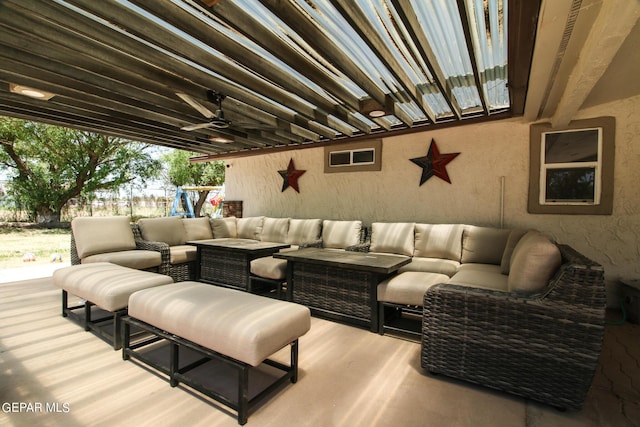 exterior space featuring ceiling fan and an outdoor living space