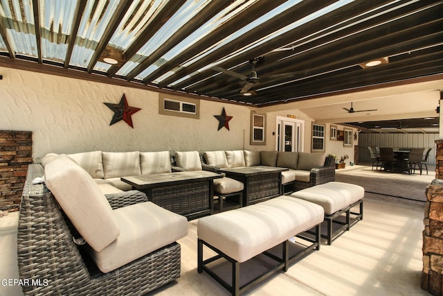 view of patio / terrace featuring ceiling fan and an outdoor living space