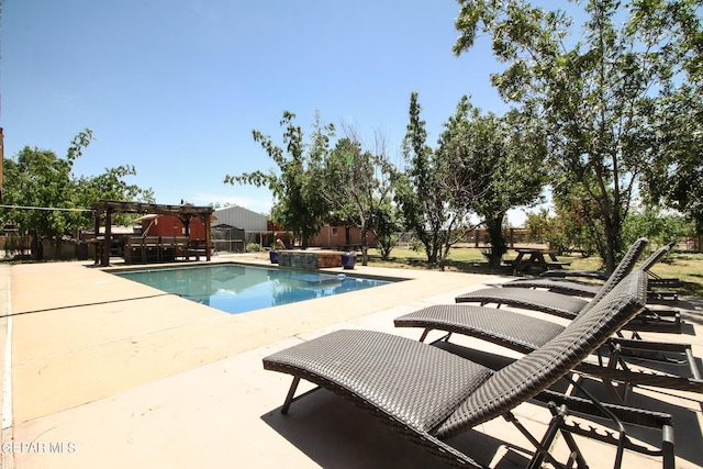 view of pool with a patio and an in ground hot tub